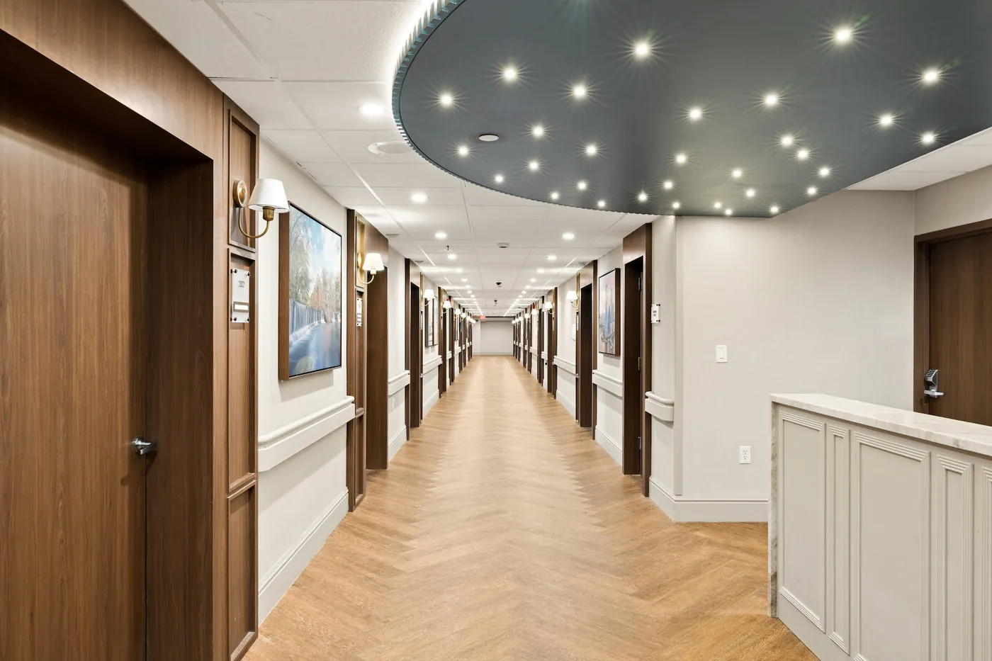 Renovated corridor with a starlit ceiling feature and herringbone floors